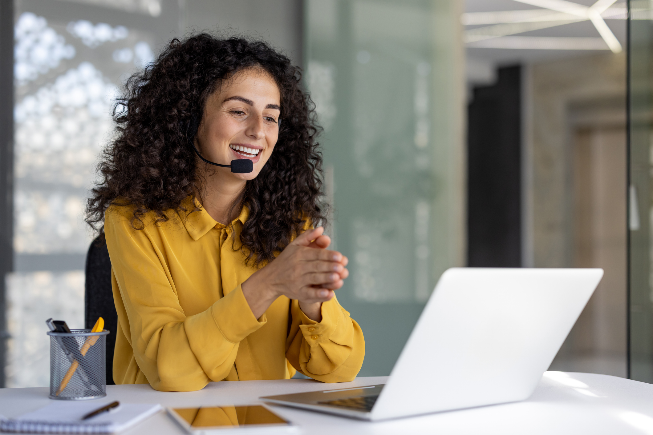 Woman smiling during a video call meeting.