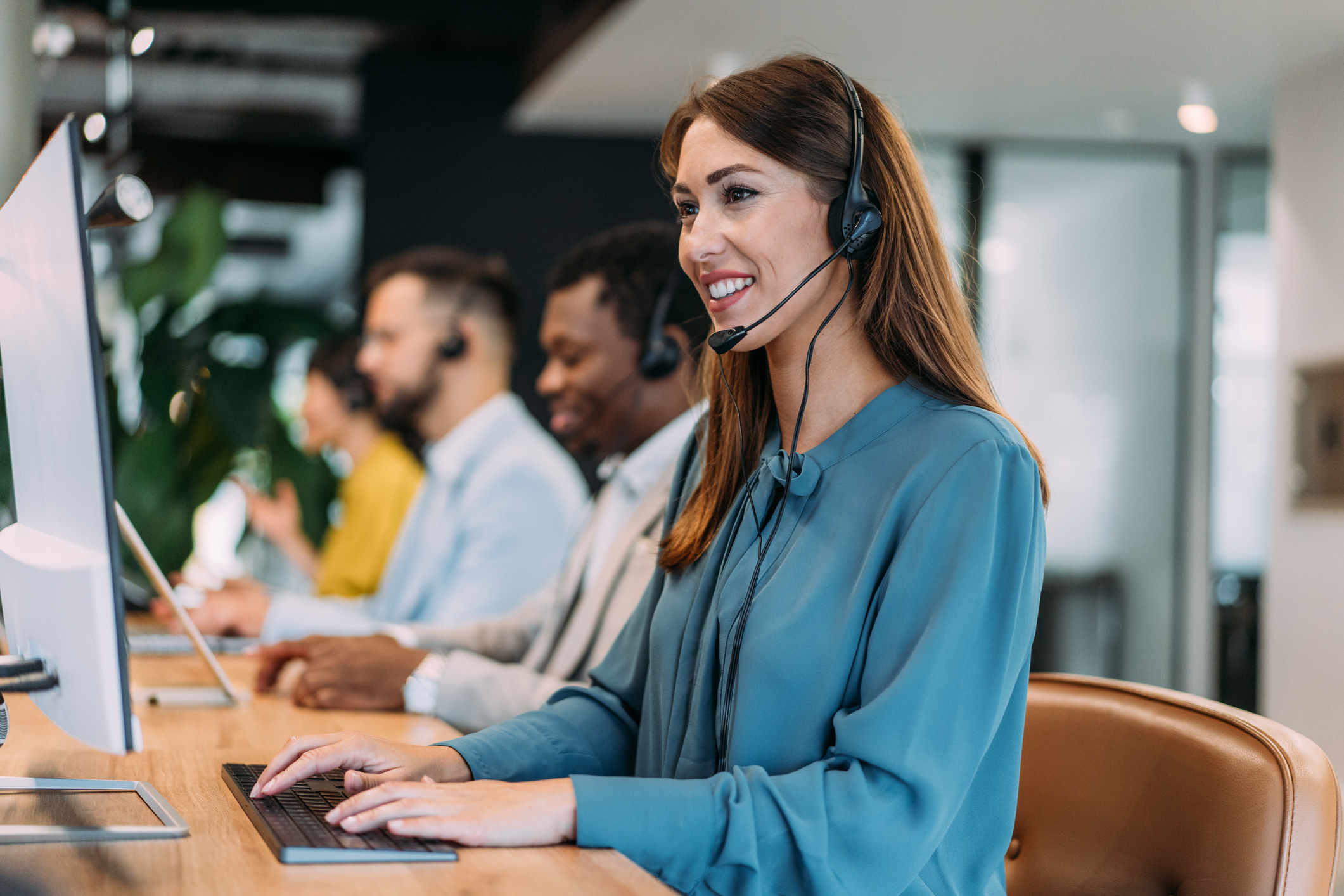 Smiling customer service representative wearing headset