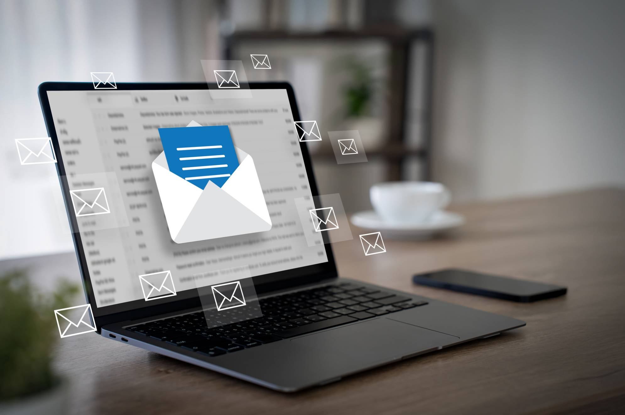 Laptop displaying incoming email notifications